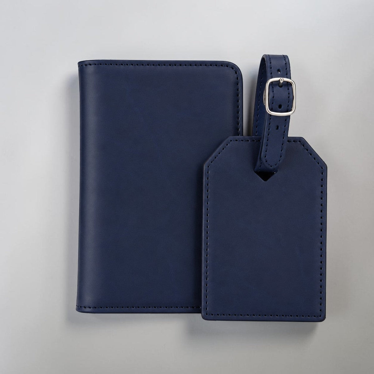 Engravr store display travel gift set featuring a navy leather RFID passport wallet and matching luggage tag.