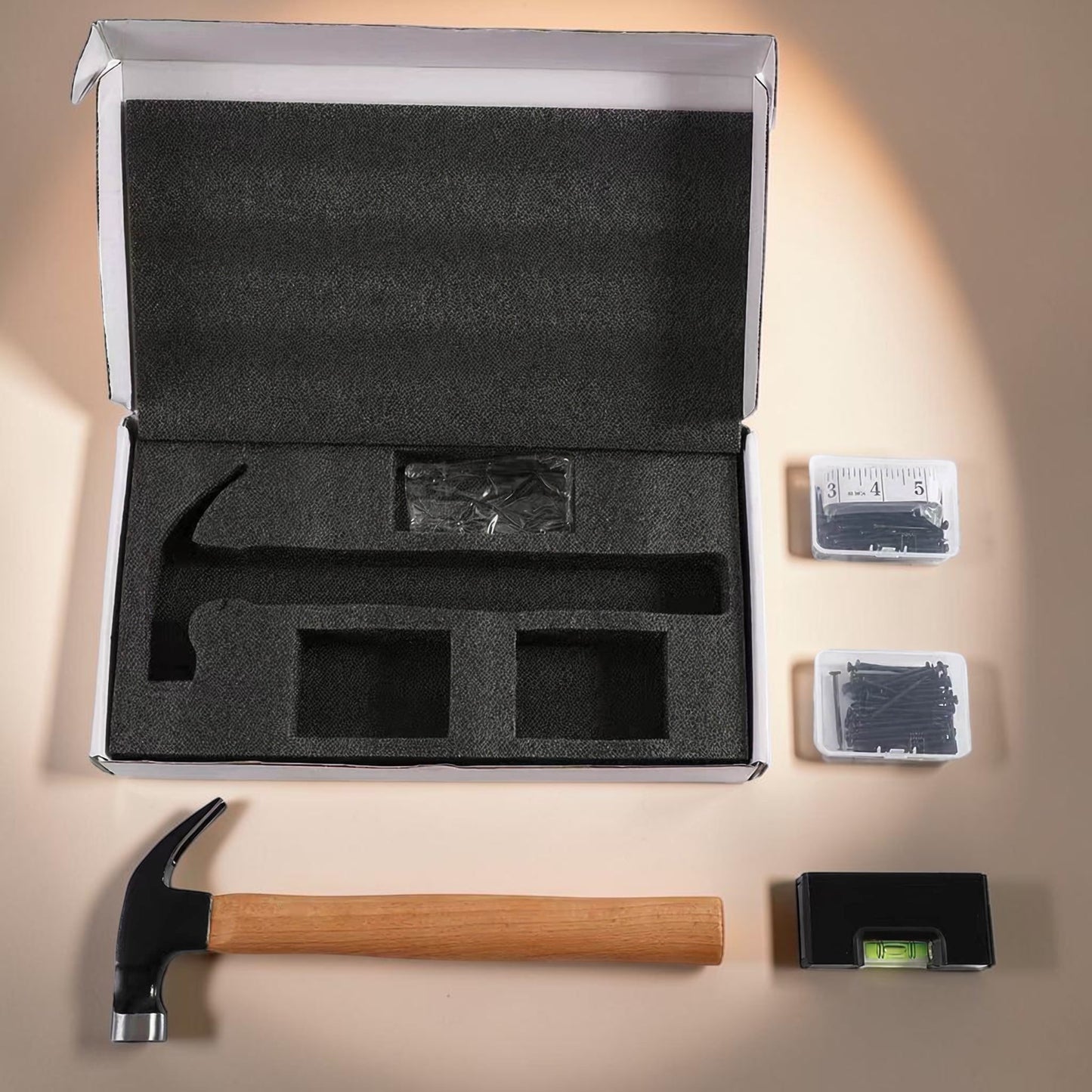 Open tool box with foam lining, hammer, nails, and level perfect builder's gift, housewarming gift, present for new homeowners