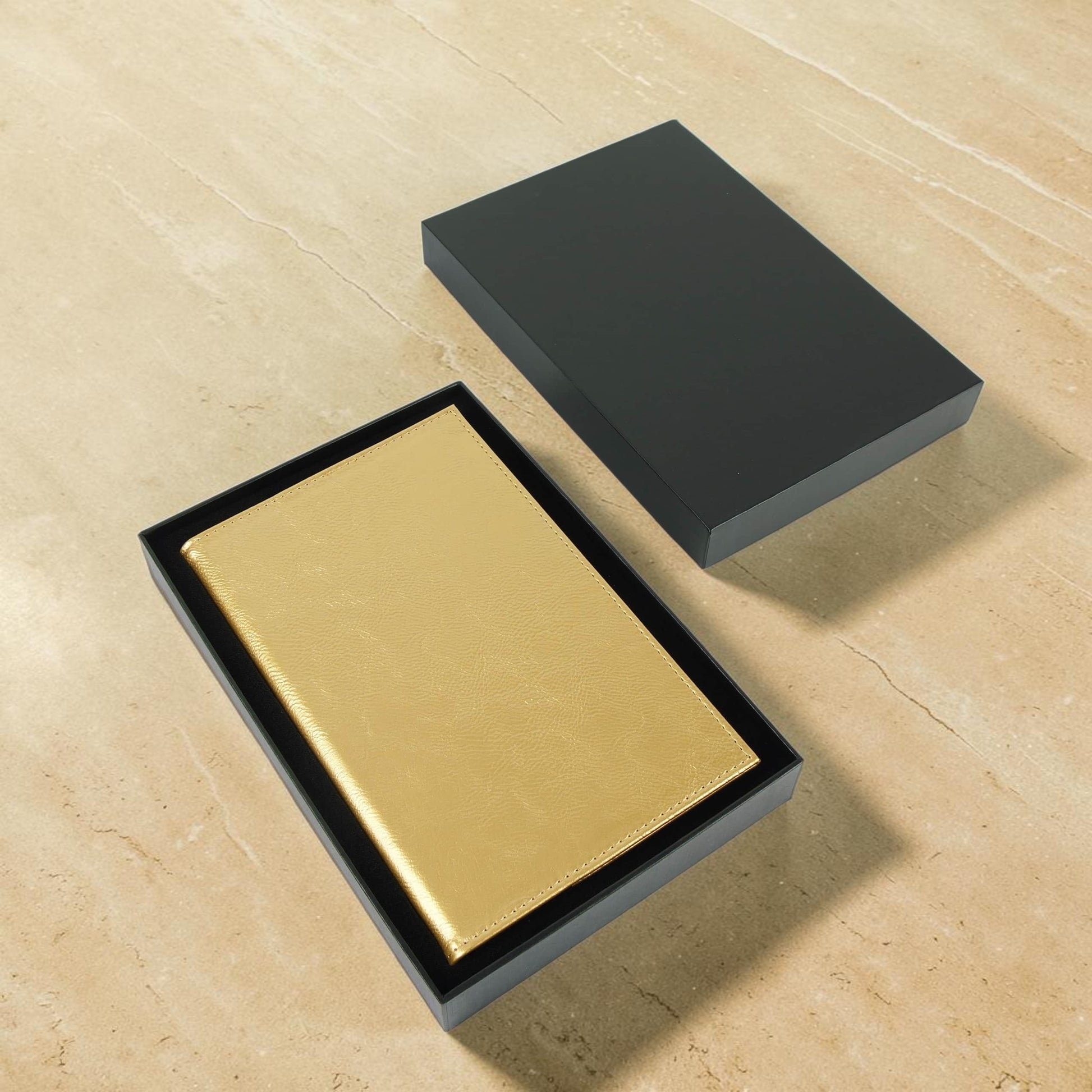 Gold wallet in an open black box for wedding party gift graduation present off-to-college