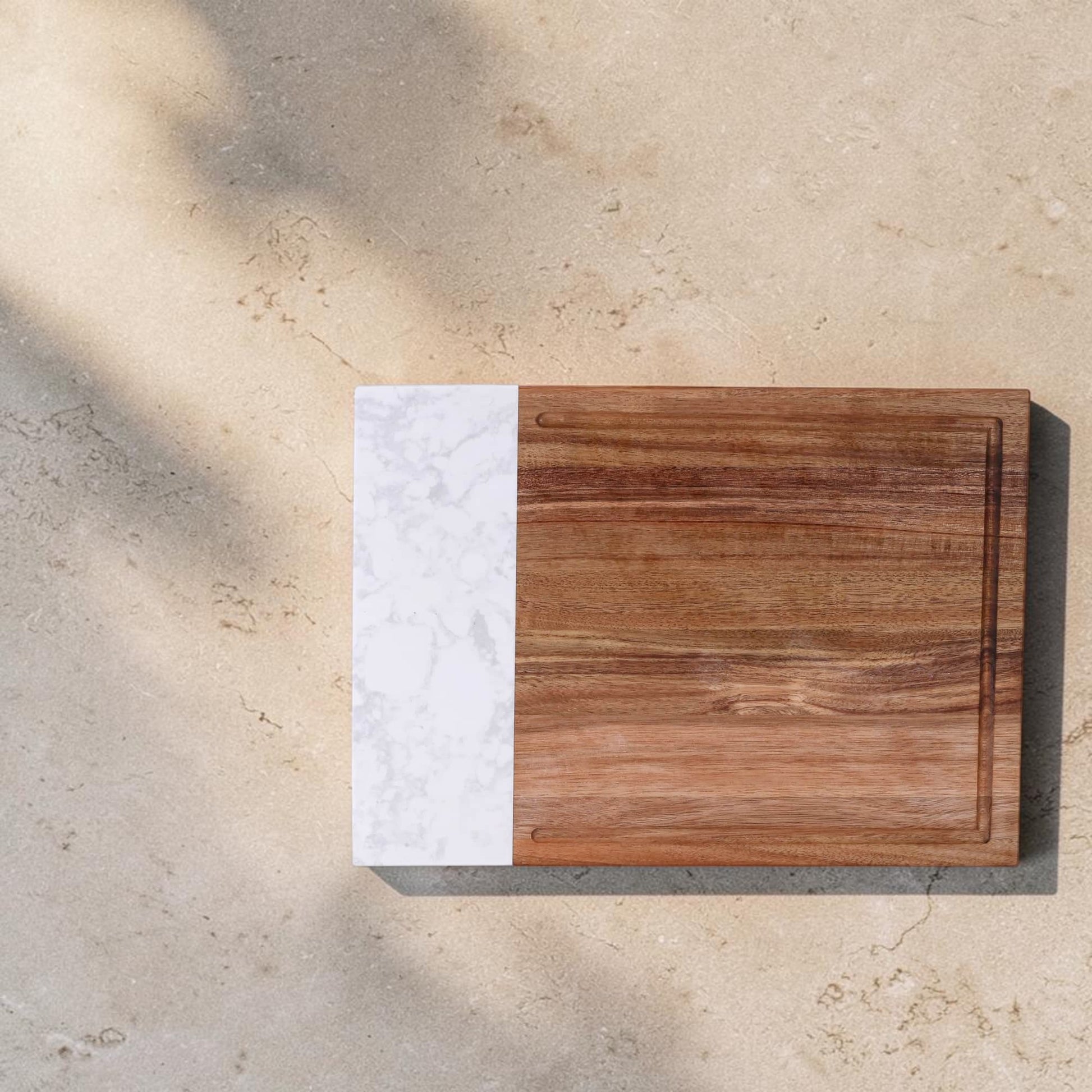 Premium marble and acacia cutting board personalized with family name engraving